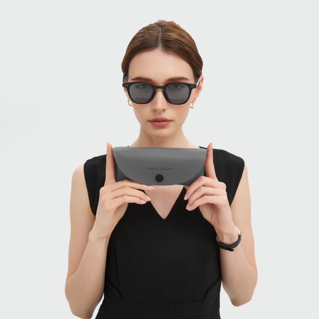Model holding the Louis protective case – black frame sunglasses
