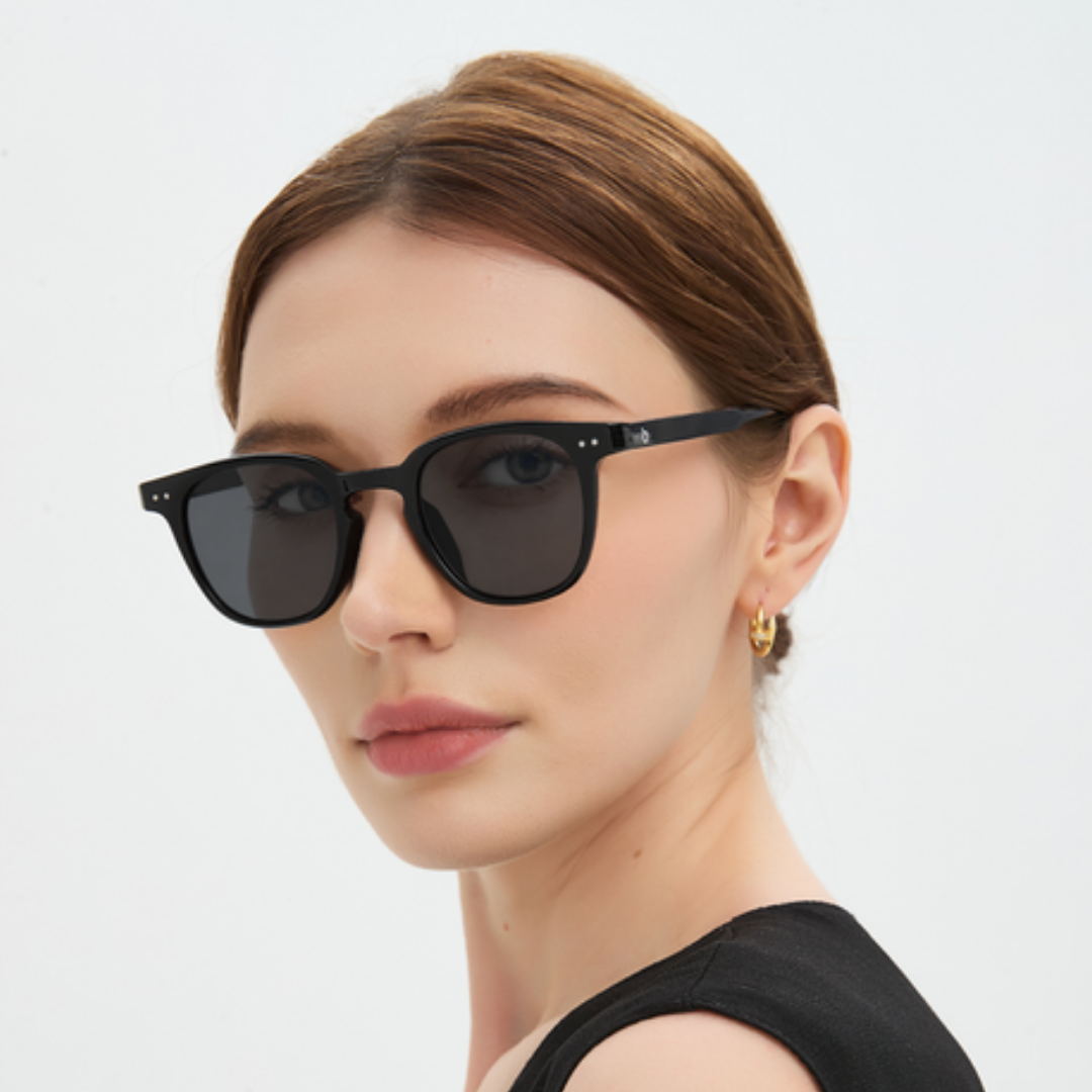 Portrait wearing Louis sunglasses, light grey lenses, black frame