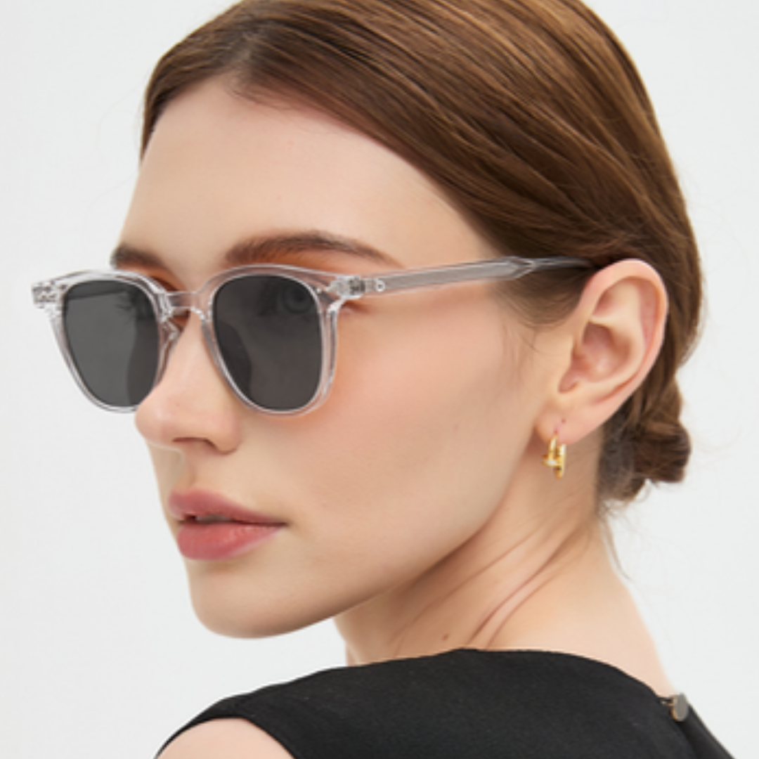 Portrait wearing Louis Crystal sunglasses, light grey lenses, transparent frame