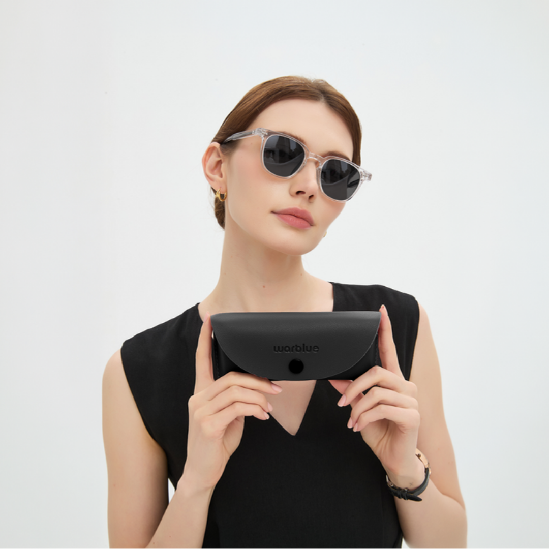 Model holding the Auguste protective case – Crystal frame sunglasses